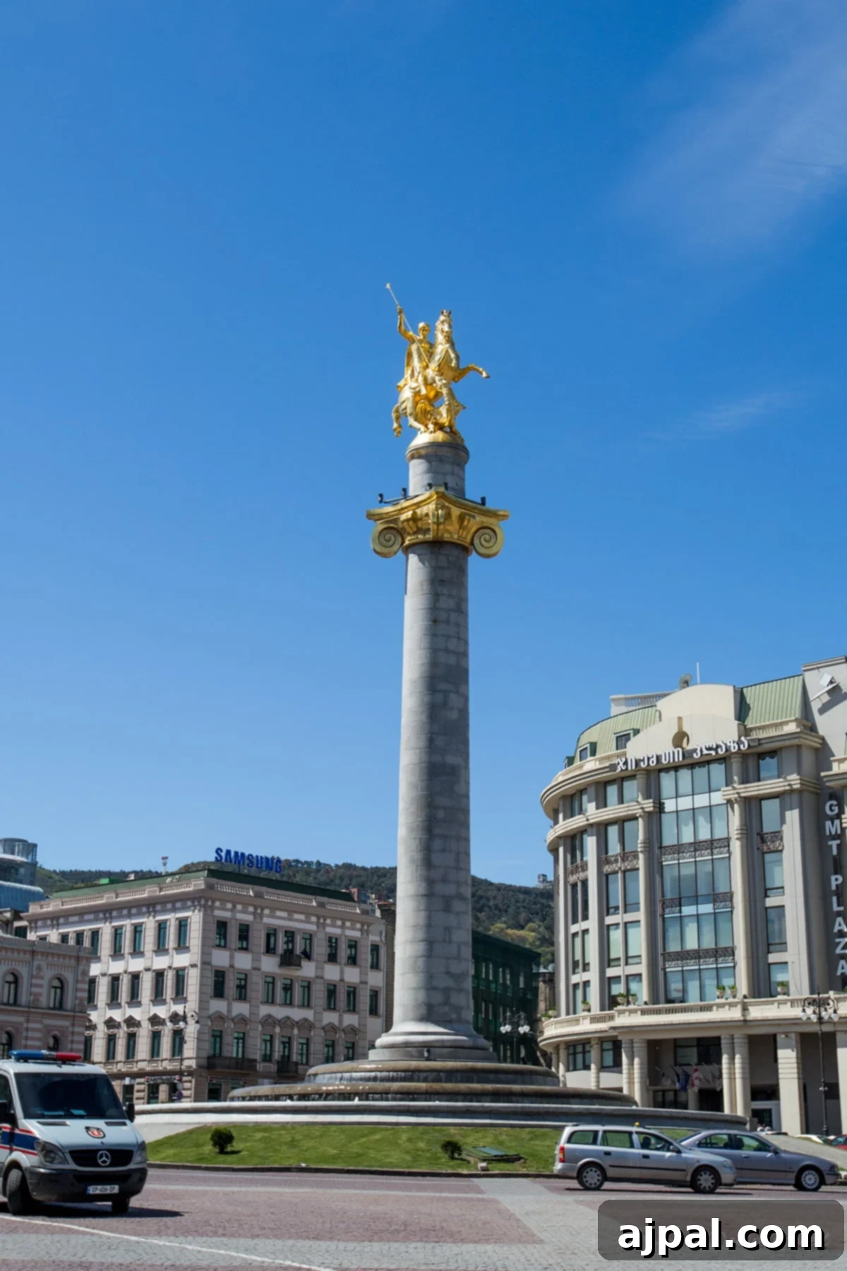 Freedom Square, Tbilisi - A grand central square with the Golden Statue of St. George and classical buildings under a clear sky.