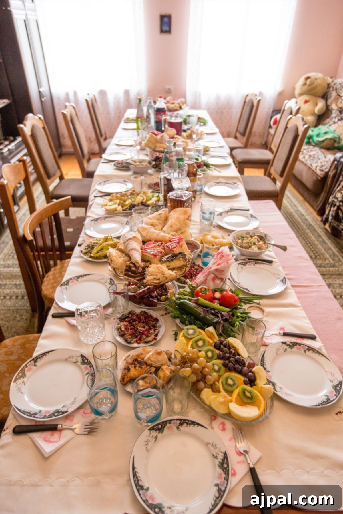 Tbilisi Travel Guide 5 A table set for a formal Georgian Supra, laden with traditional dishes and wine.