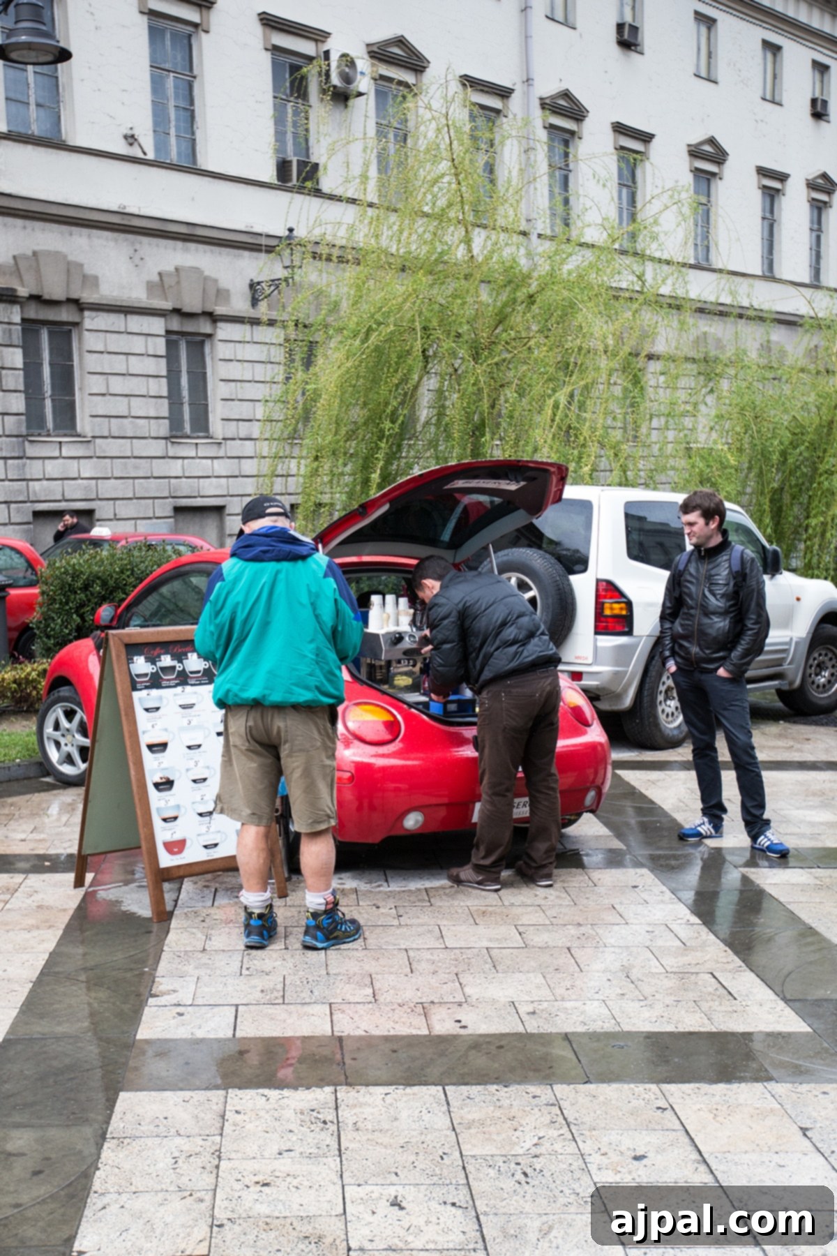 Tbilisi Travel Guide 10 People enjoying espresso served from the back of a vintage VW bug, a common sight in Tbilisi.