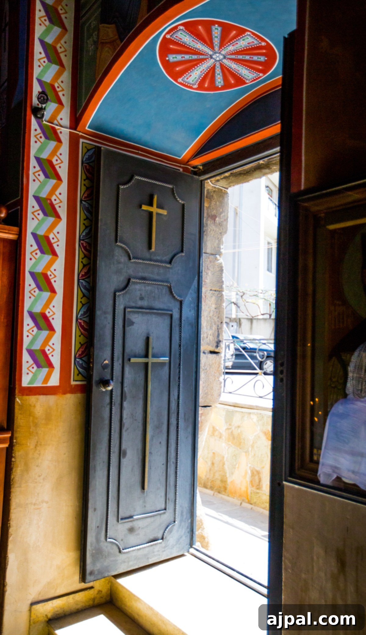 A beautifully adorned doorway with a cross at the Lurji Blue Monastery, Tbilisi