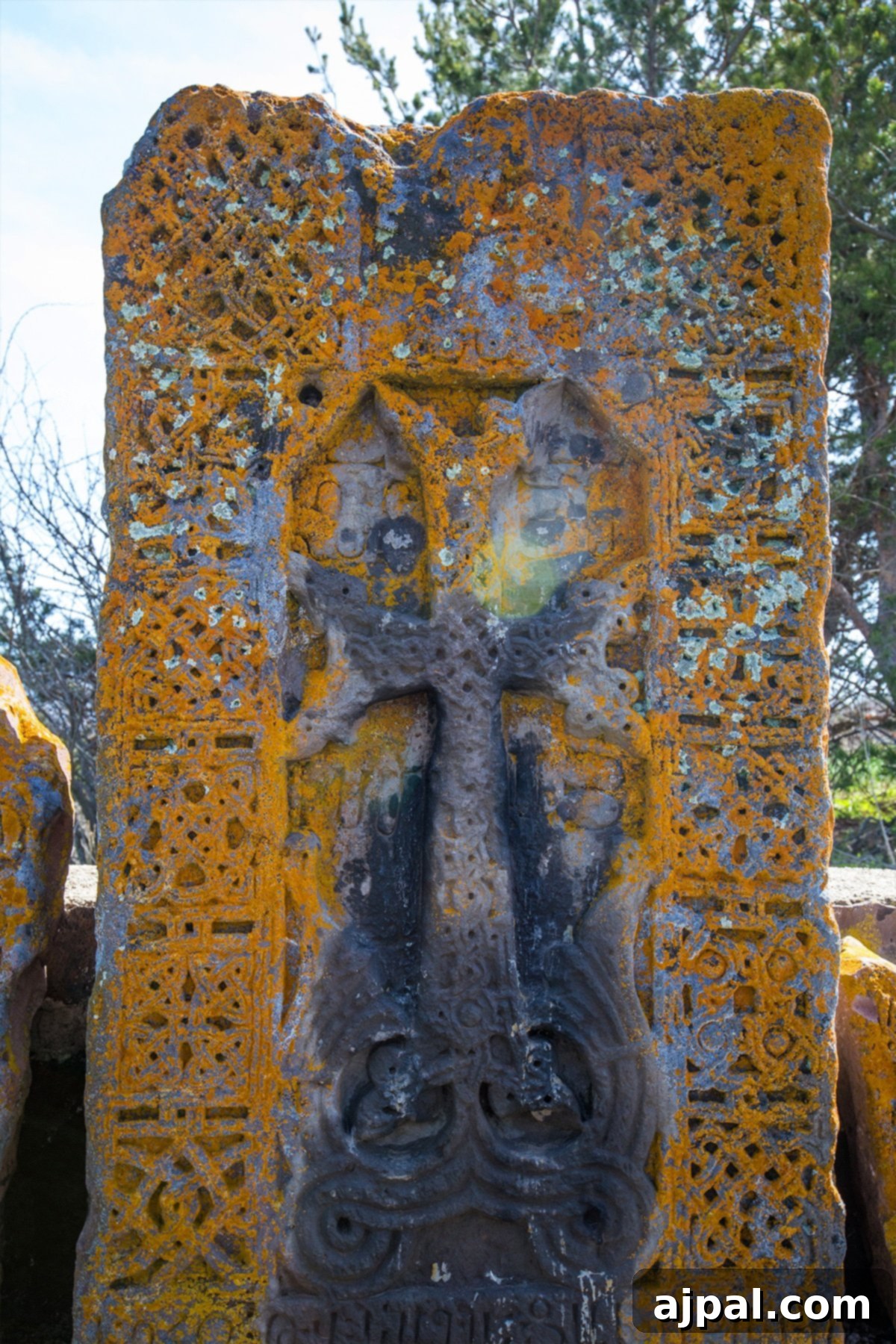 A beautifully carved cross-adorned stone block (khachkar) found at Armenia’s historic Sevanavank Monastery Ruins near Lake Sevan.