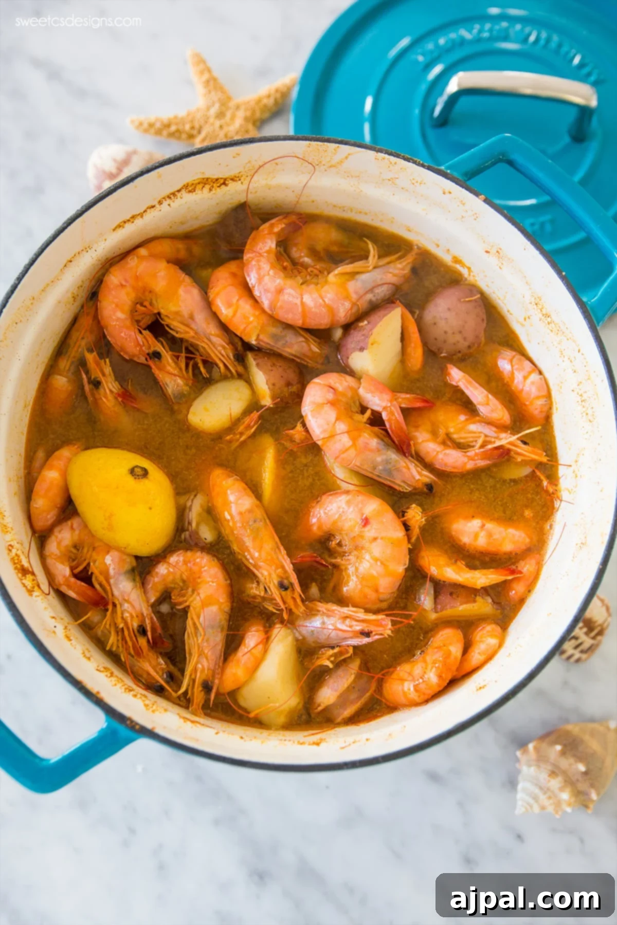 Ultimate Shrimp Boil 3 A close-up view of a pot of Quick and Easy Shrimp Boil, showcasing the perfectly cooked shrimp and tender potatoes immersed in the flavorful broth.