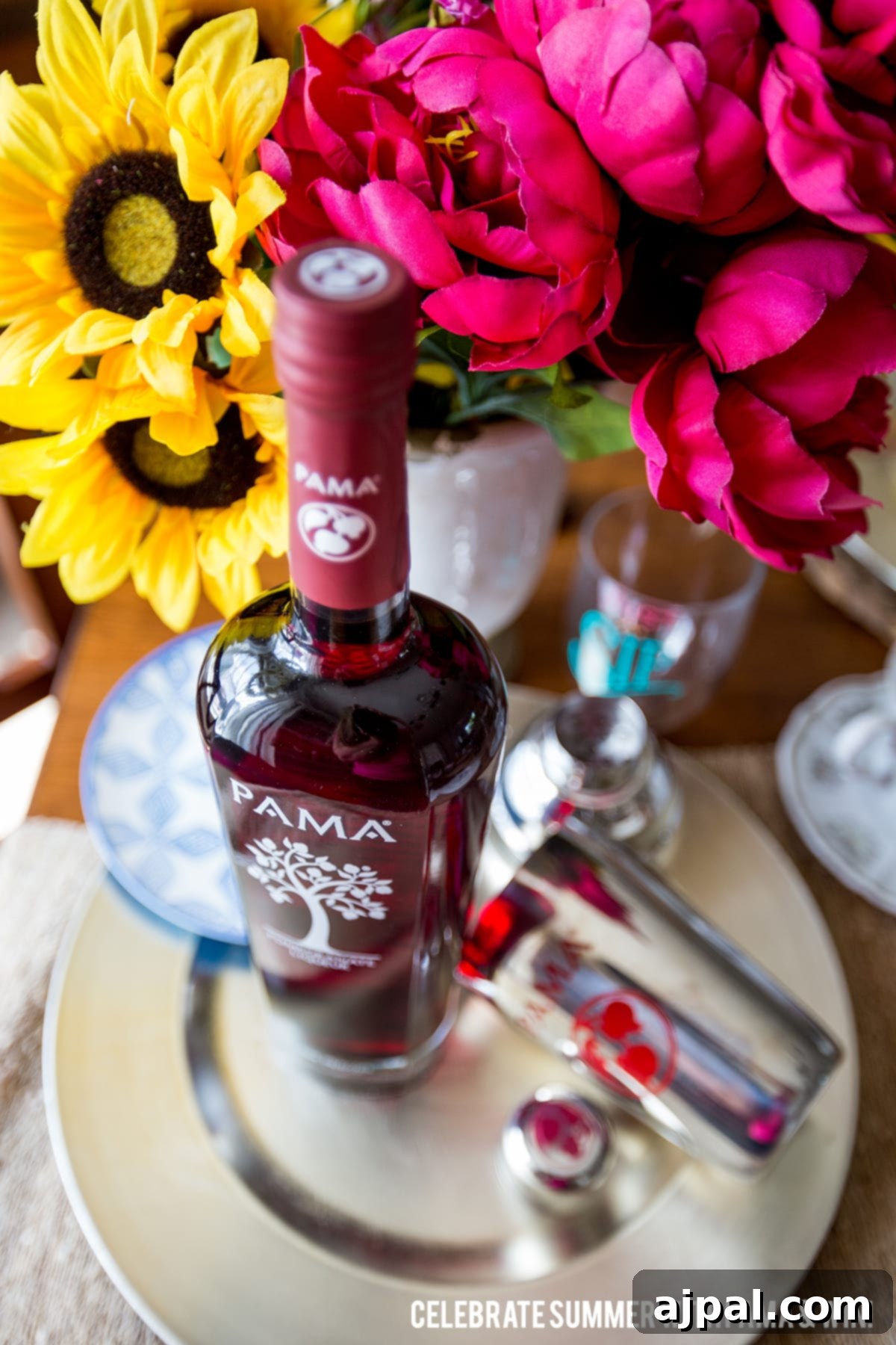 Ruby Brew-Rita 3 A bottle of PAMA Pomegranate Liqueur, ready to be used in festive summer cocktails, captures the essence of celebration.