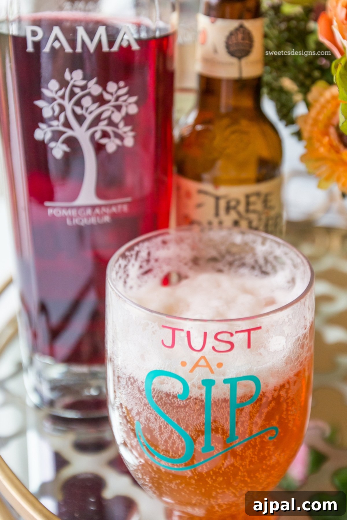 Ruby Brew-Rita 4 A refreshing glass of Pomegranate Beeritas on a table, ready for a delicious summer sip.