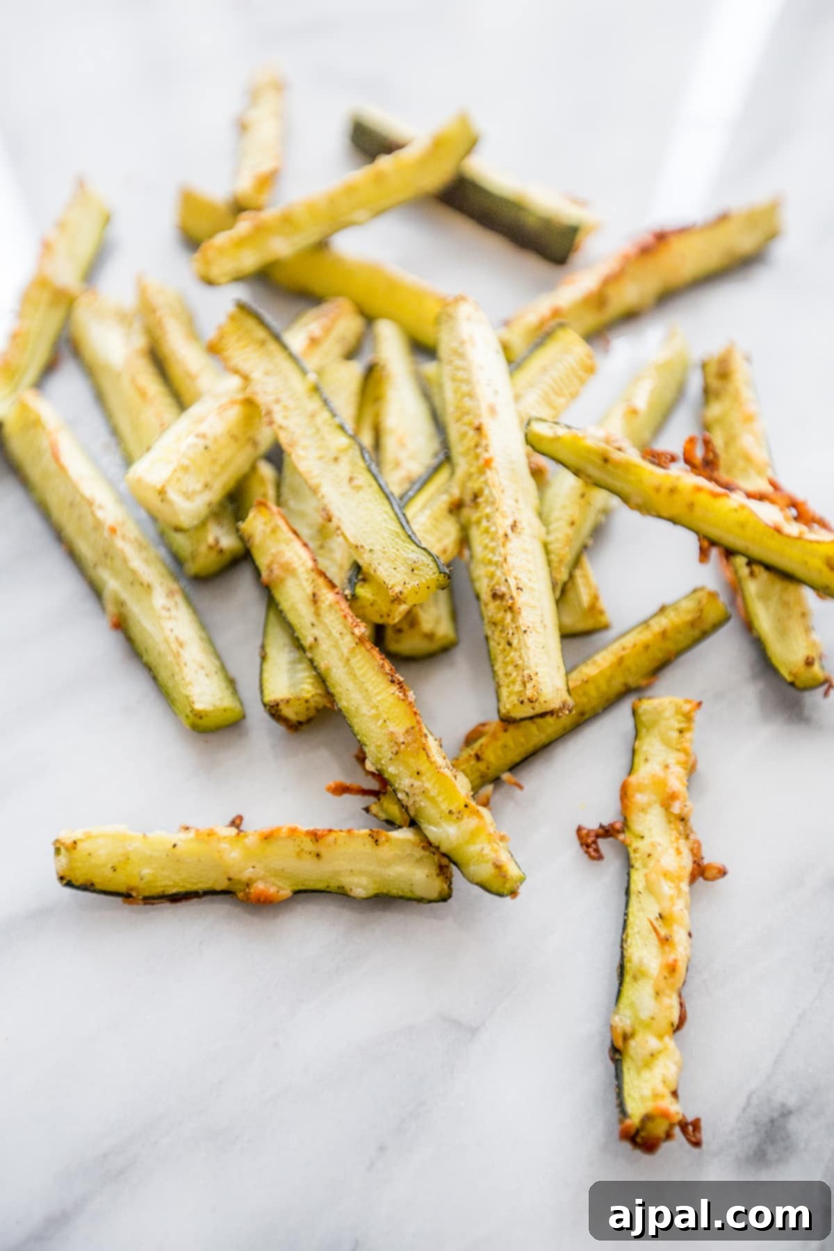 Keto Garlic Parm Zucchini Fries 2 Crispy Keto Garlic Parmesan Zucchini Fries baked to golden perfection