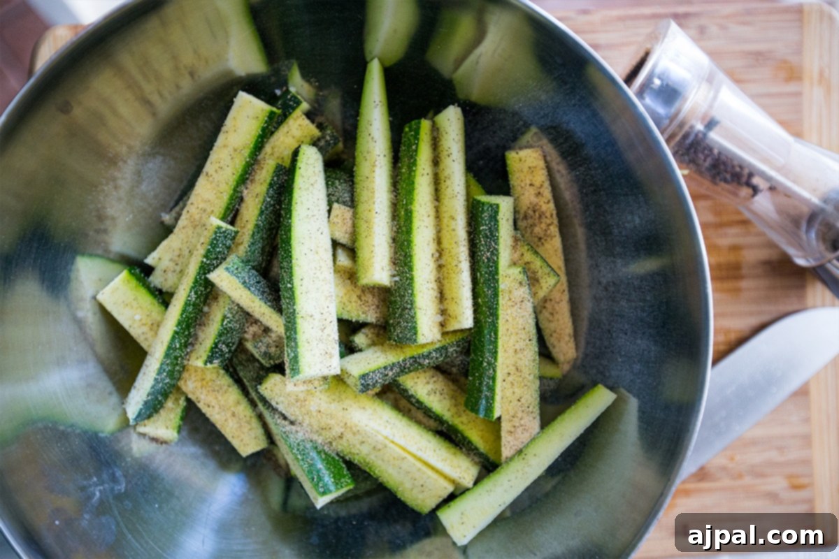 Keto Garlic Parm Zucchini Fries 4 Baked keto zucchini fries with a perfect golden crisp and seasoned with Parmesan and garlic