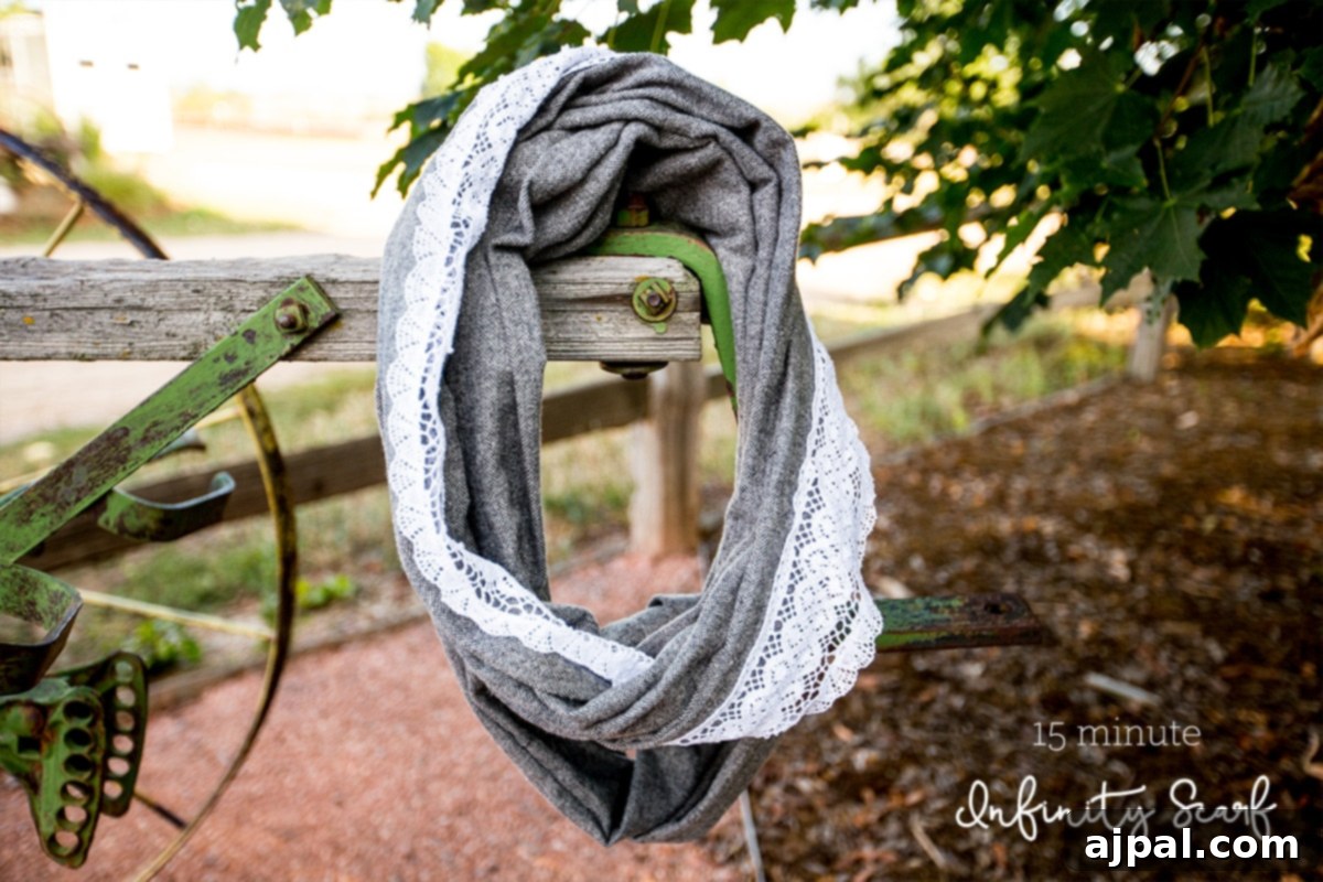 Whip Up a Lace Infinity Scarf in 15 Minutes 2 A beautifully crafted lace embellished infinity scarf draped casually over a rustic wooden fence, showcasing its intricate details and soft cotton fabric.