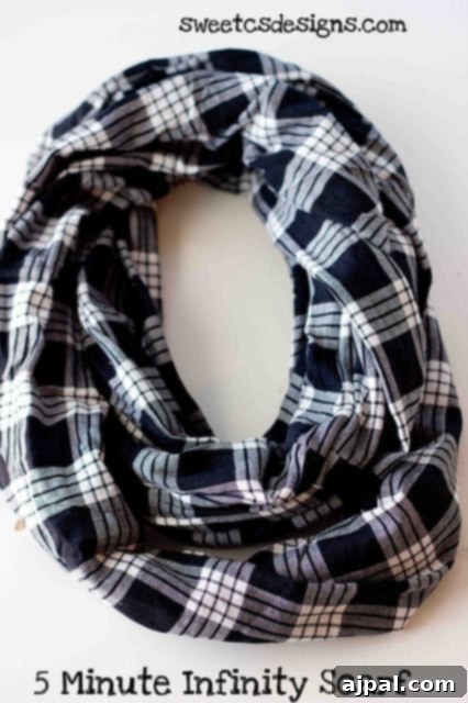 Whip Up a Lace Infinity Scarf in 15 Minutes 3 A close-up shot of a stylish infinity scarf, highlighting its soft fabric and inviting texture, with text overlay: 'Make an #infinityscarf in just five minutes! This is the easiest tutorial for fun, fashionable circle scarves! No advanced skills- you just have to sew a line.'