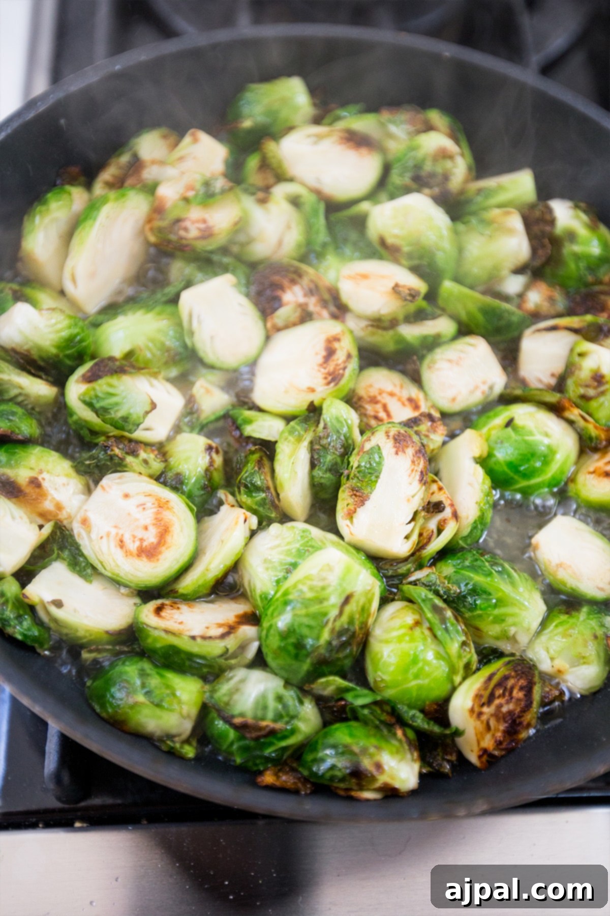 Brussels sprouts cooking in a pan