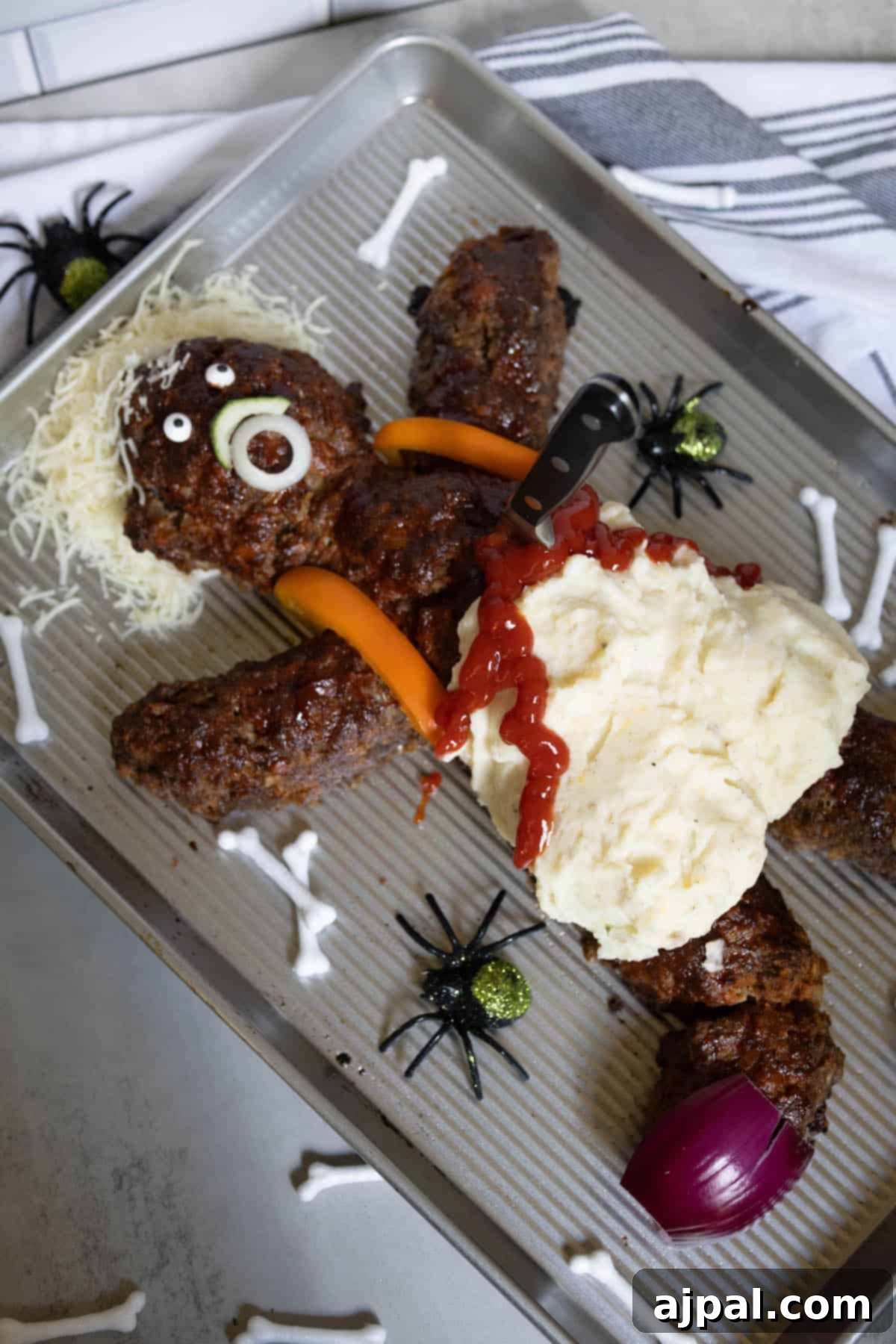 Spooktacular Halloween Treats You Need to Try 29 A tray of dead man meatloaf, covered in mashed potatoes and ketchup.