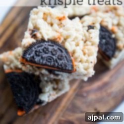 Krispie treats made with Halloween Oreos displayed on a cutting board.