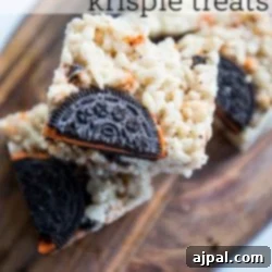 Krispie treats made with Halloween Oreos displayed on a cutting board, ready to be served.