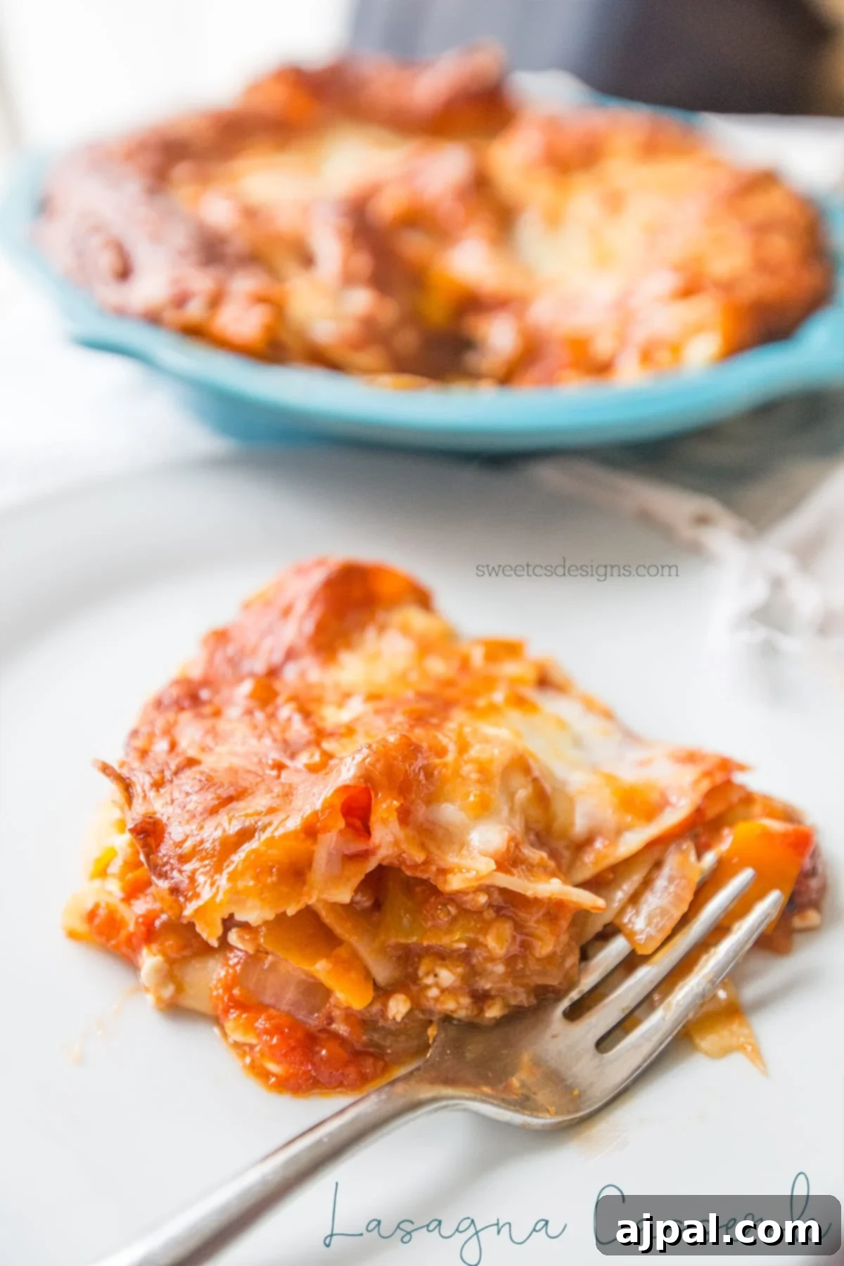 A perfectly portioned slice of lasagna casserole sits on a plate, showcasing its delicious layers and ready to be enjoyed.
