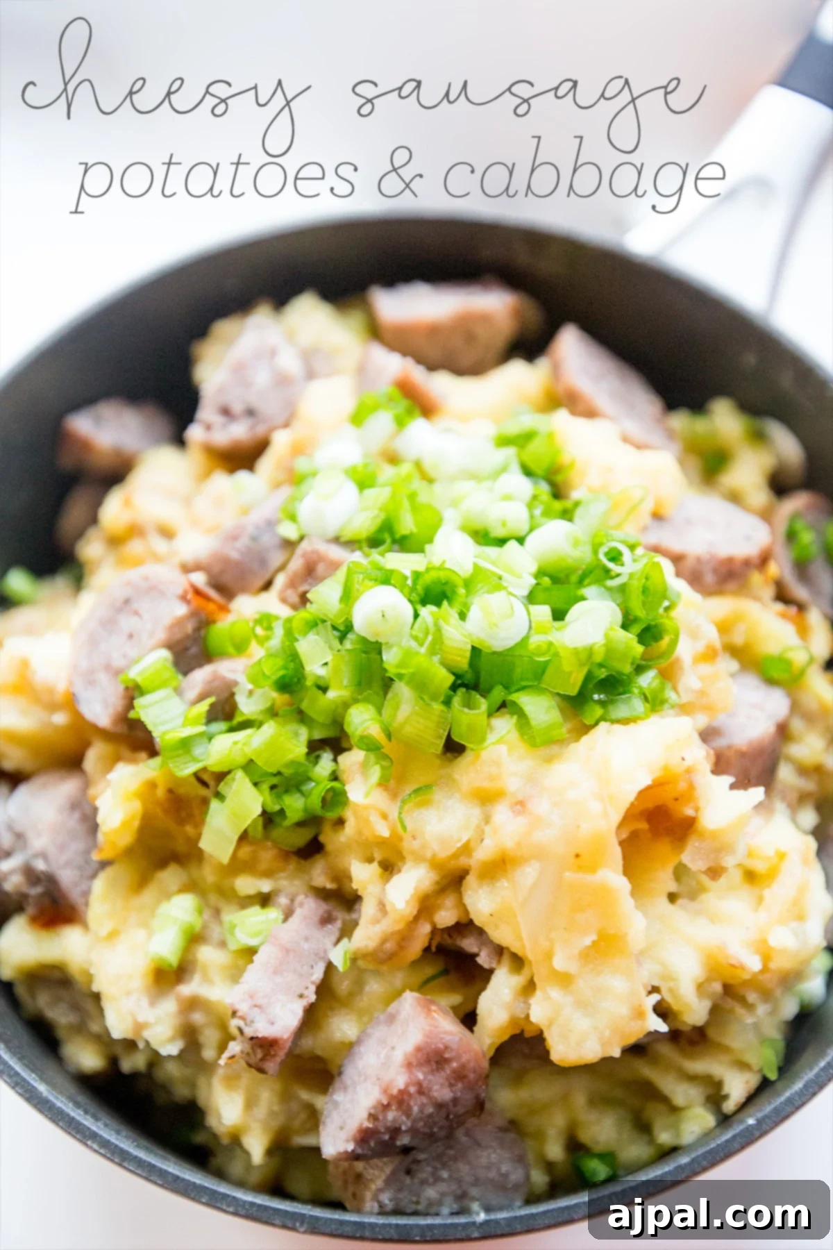 Hearty Cheesy Sausage Potato and Cabbage Bake 2 Hearty skillet dinner featuring cheesy sausage, tender potatoes, and vibrant green onions