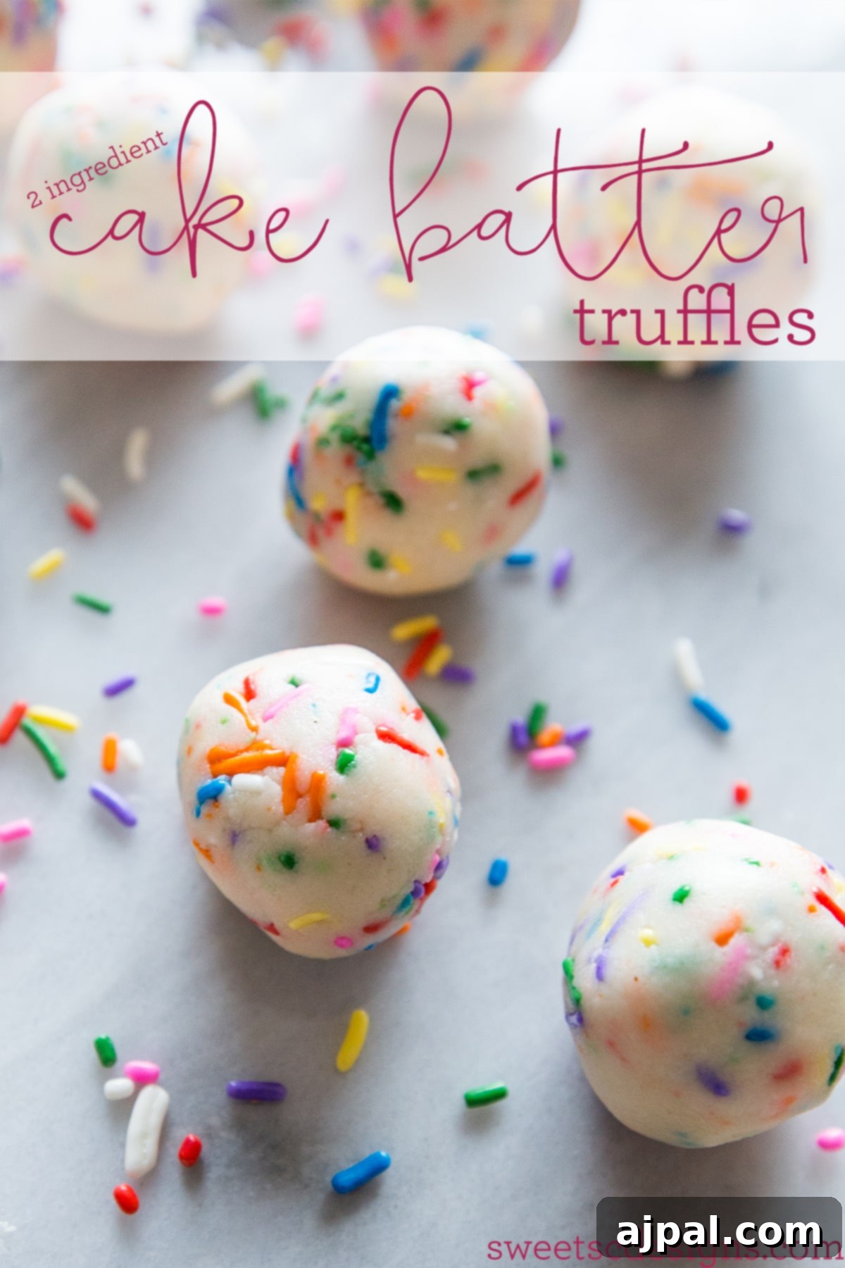Close-up of numerous cake batter truffles, adorned with an explosion of colorful sprinkles, ready to be enjoyed. These two-ingredient treats are unbelievably easy and delicious!