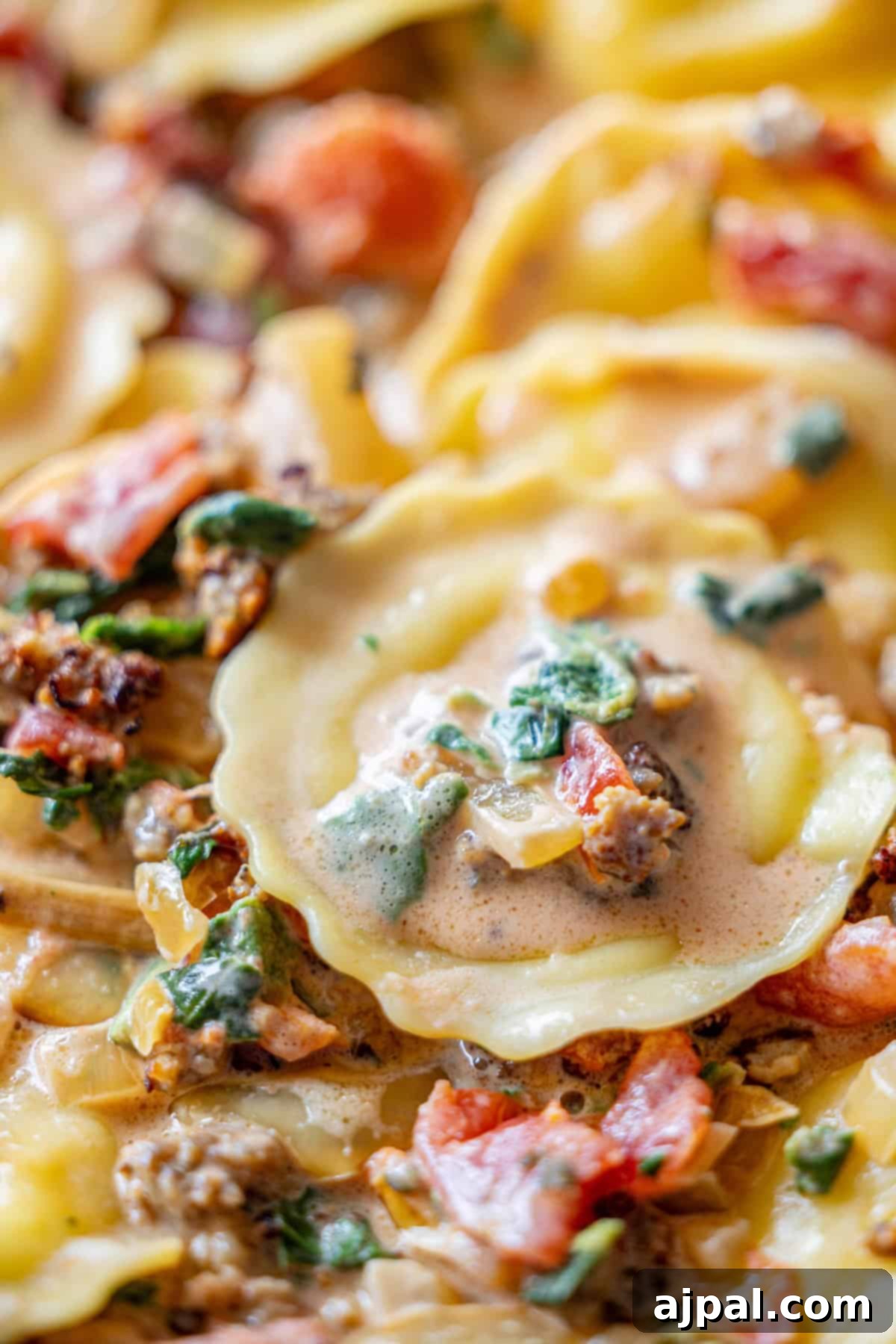 Creamy Tuscan Sausage Ravioli 3 Hearty ravioli with a rich tomato spinach cream sauce, featuring savory ground sausage, sun-dried tomatoes, and fresh greens.
