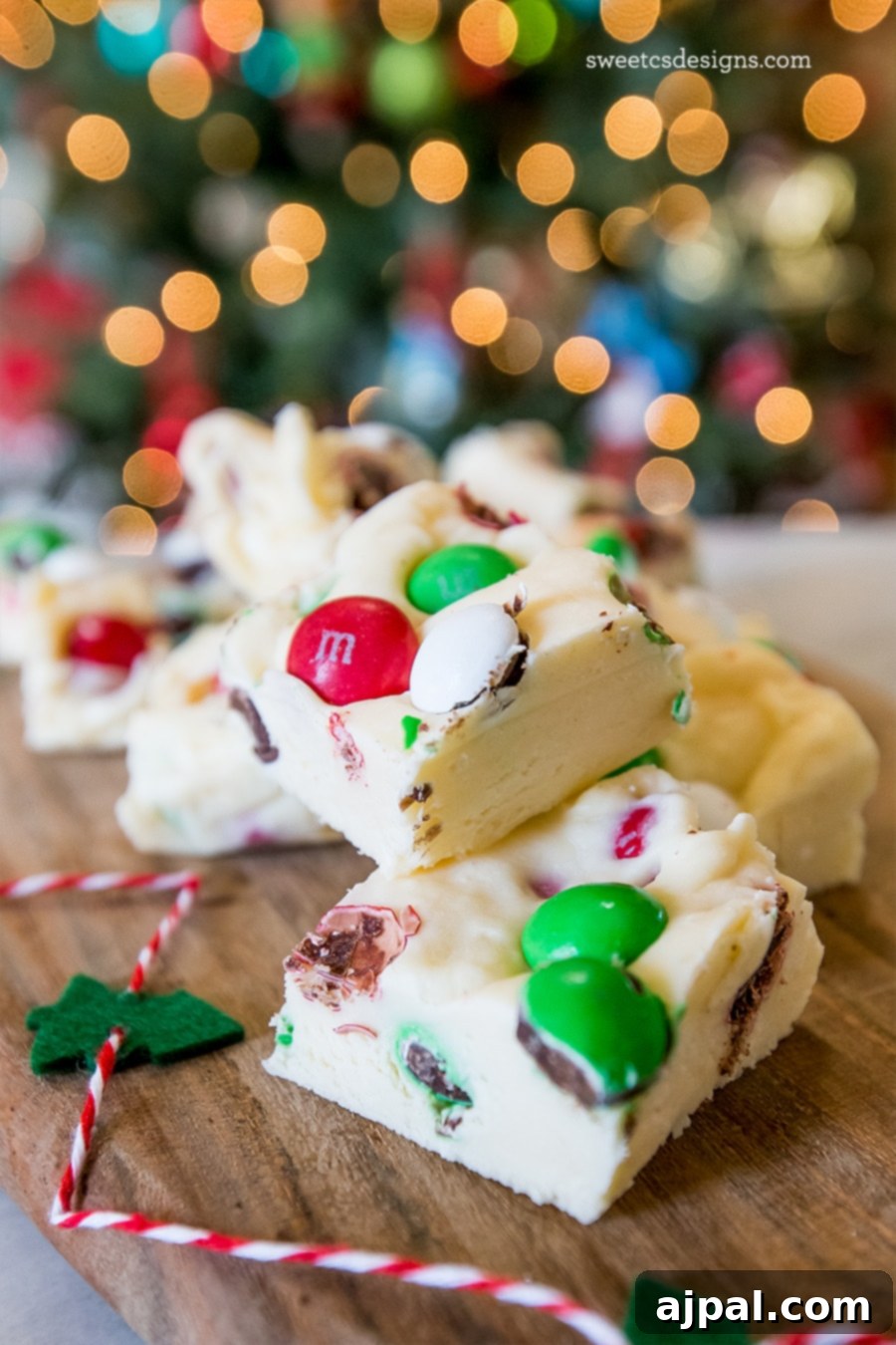 Festive Confectionery Fudge 6 A close-up view of festive cookie and candy fudge, showcasing its rich texture and colorful candy inclusions.