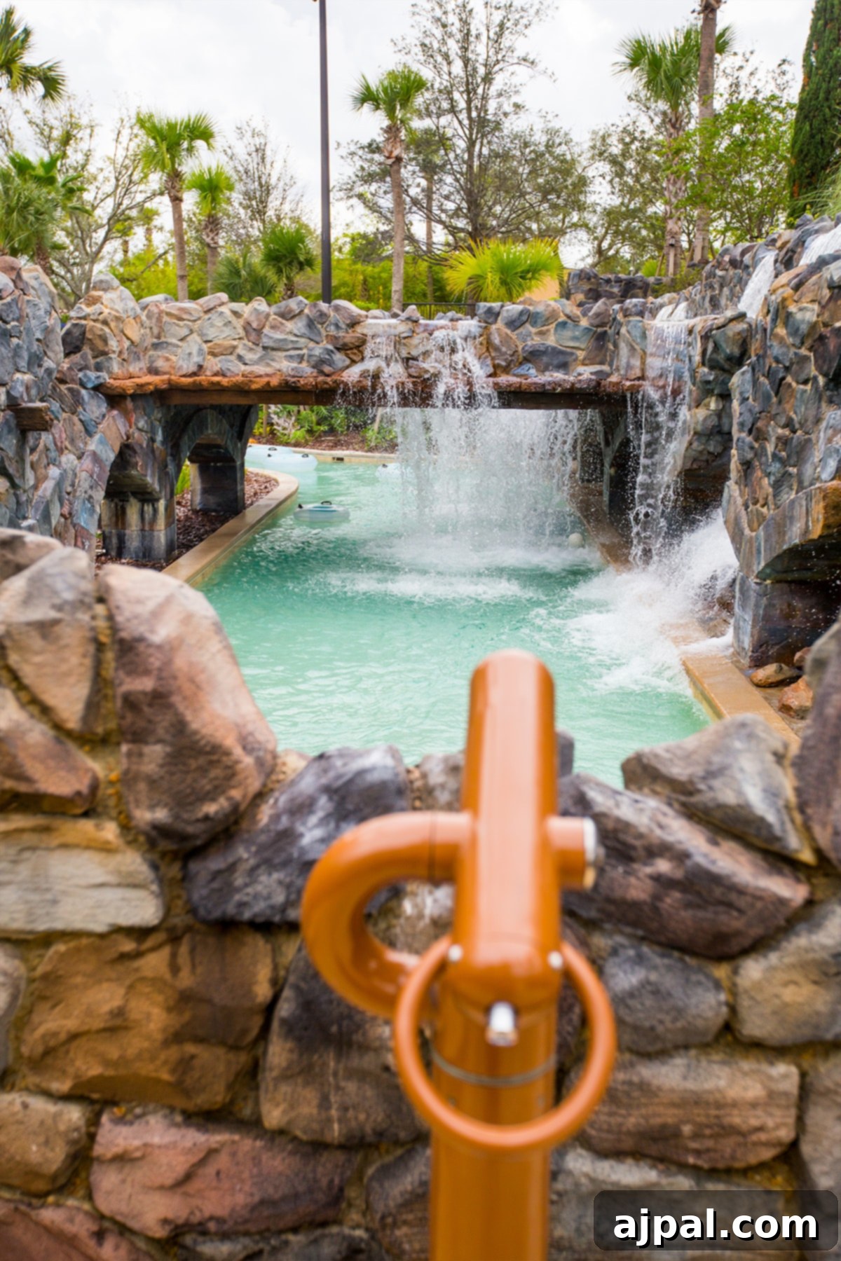 Four Seasons Orlando at Disney World A Magical Getaway 7 A Four Seasons luxury resort at Disney World featuring a pool and waterfall.