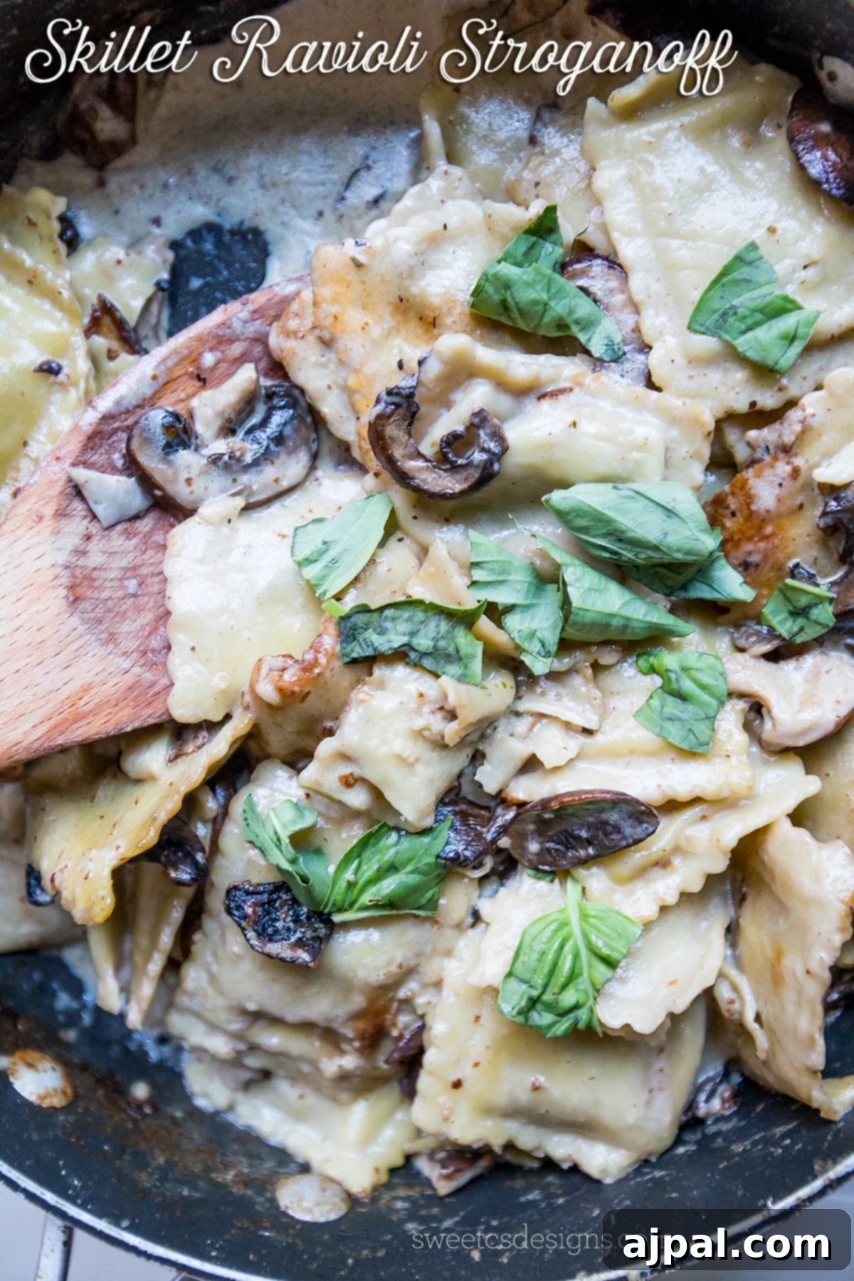 Creamy Skillet Ravioli Stroganoff garnished with fresh basil and mushrooms