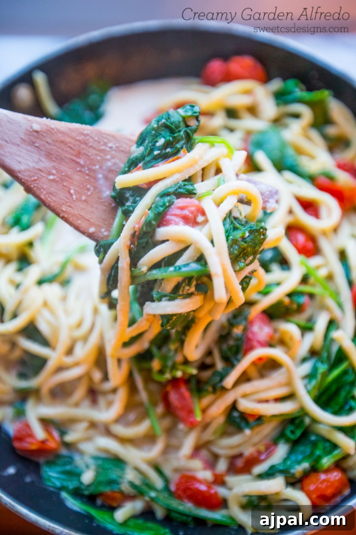 Creamy One Pot Garden Alfredo Pasta Skillet with fresh tomatoes and spinach, ready in under 15 minutes.