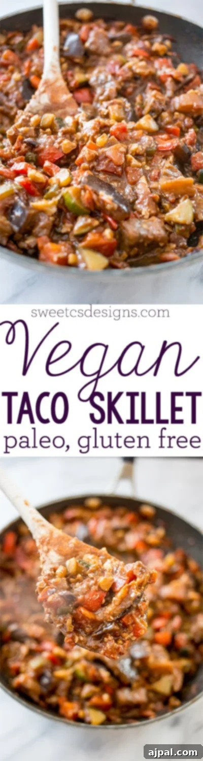 Hearty Paleo Vegan Taco Skillet 7 A tall, slender image of a skillet filled with a rich vegan taco mixture, showcasing the appetizing texture of the vegetables and walnuts.