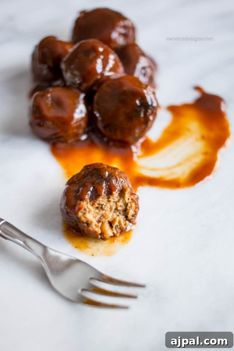 Smoky Vegan Paleo BBQ Meatballs 2 Delicious paleo vegan BBQ meatballs in a rich sauce, served on a plate as a healthy appetizer or main dish.