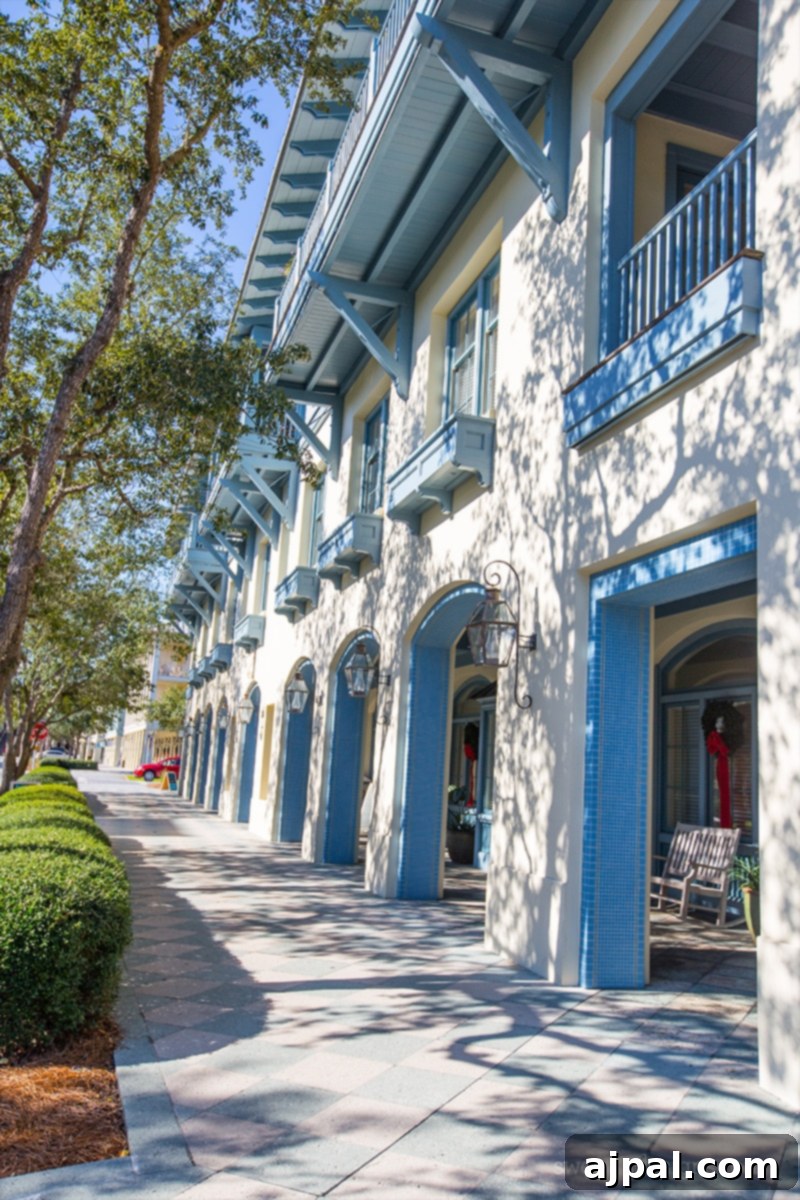 Yuletide in Paradise Seaside Florida 3 Watercolor Florida shops decorated for Christmas, featuring white and blue accents under a clear sky.