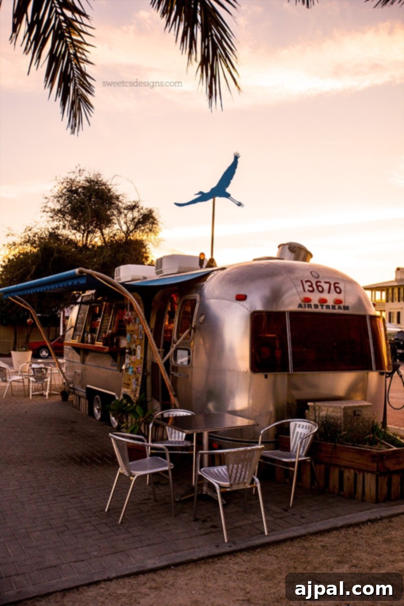 Yuletide in Paradise Seaside Florida 9 Seaside Florida Airstream Food Trucks, a row of silver trailers in a parking lot, bustling during the Christmas season.