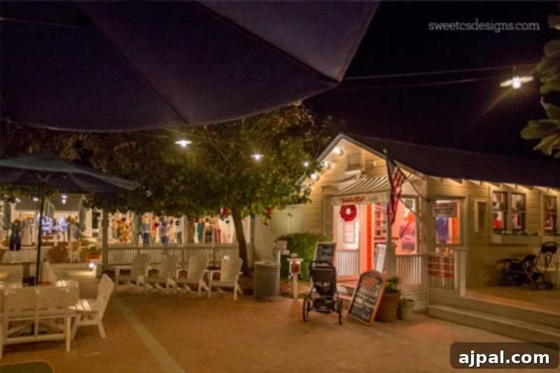 Yuletide in Paradise Seaside Florida 10 Seaside Florida at night, with the Shrimp Shack and other charming shops illuminated, creating a cozy Christmas evening.