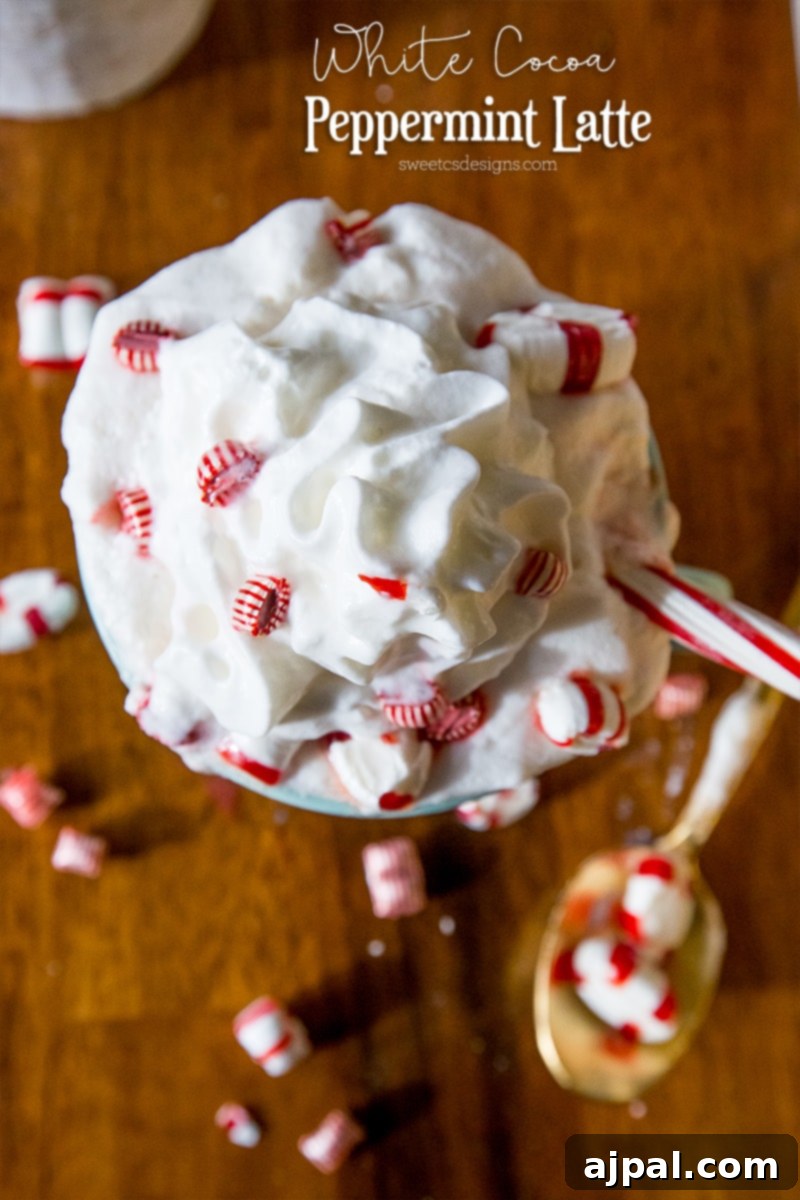 White Peppermint Mocha 3 A delicious white chocolate peppermint latte garnished with whipped cream and mini candy canes, perfect for the holidays and a cozy treat.