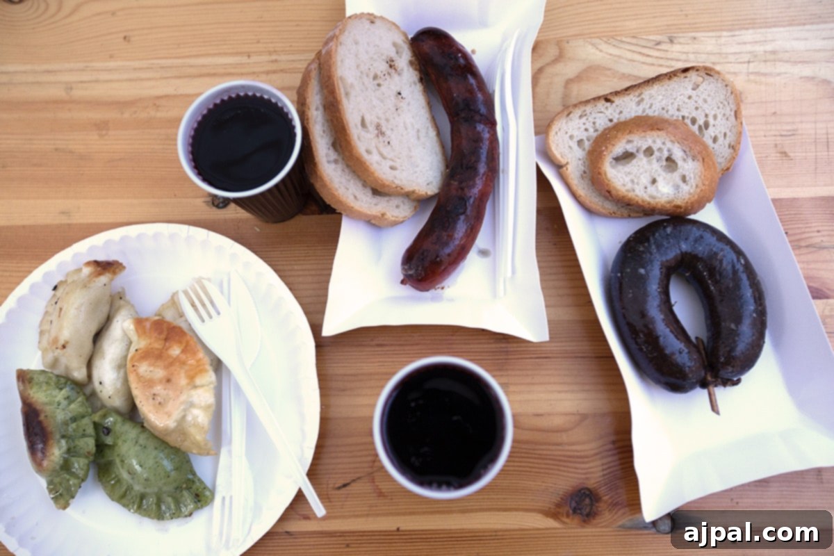 Spiced Winter Warmer 3 A rustic plate showcasing Polish street food, featuring savory sausages, pierogies, and a steaming mug of traditional mulled wine, set against the backdrop of Krakow's Market Square.