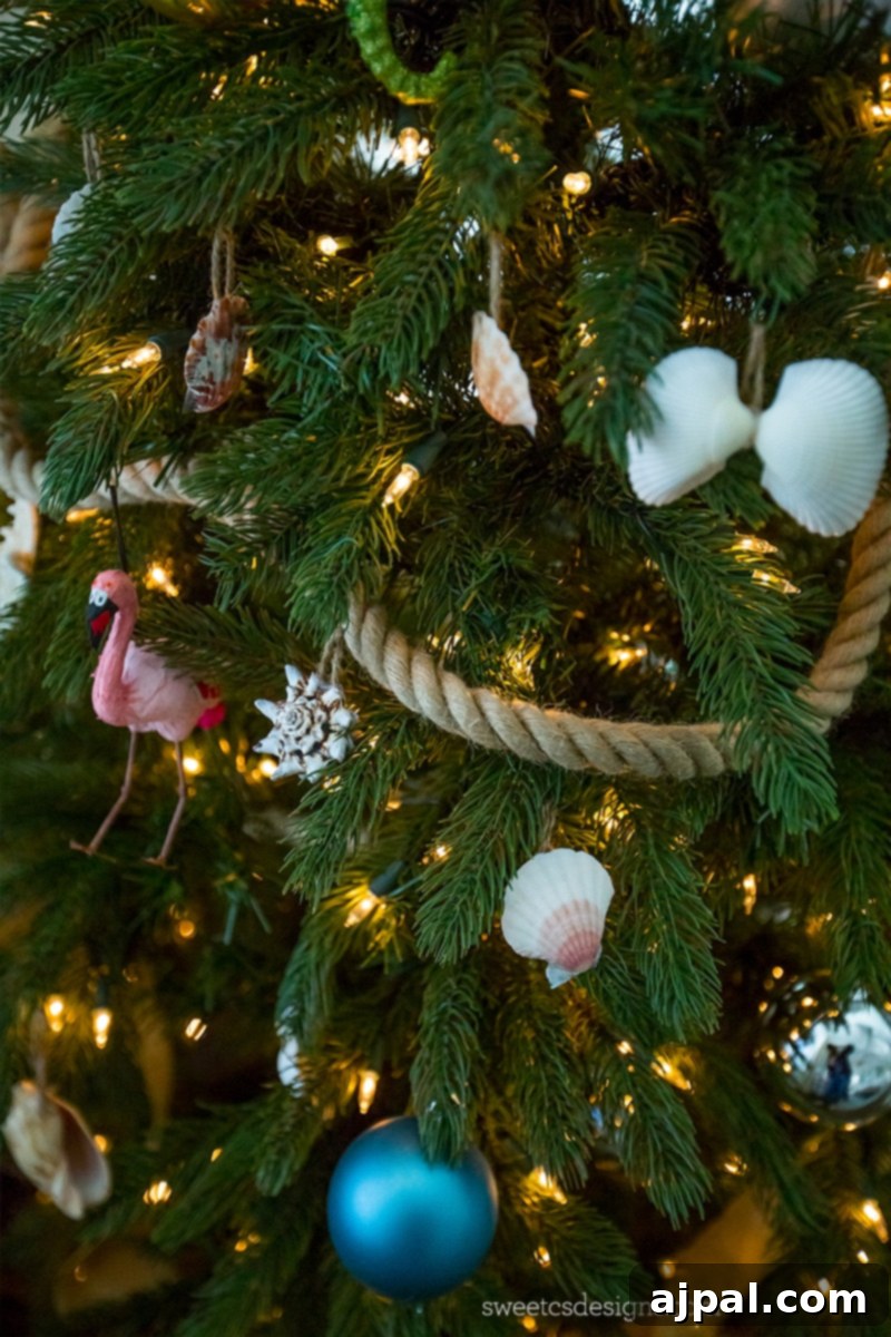 Easy Seashell Tree Decorations for a Coastal Vibe 5 A festive beach-themed Christmas tree, richly decorated with an array of easy DIY seashell ornaments, creating a charming coastal holiday display.