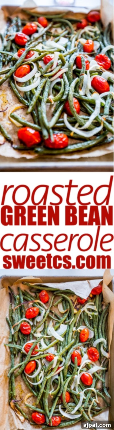 Vibrant roasted green bean salad with tomatoes and onions, close-up, showcasing its fresh and healthy appeal.