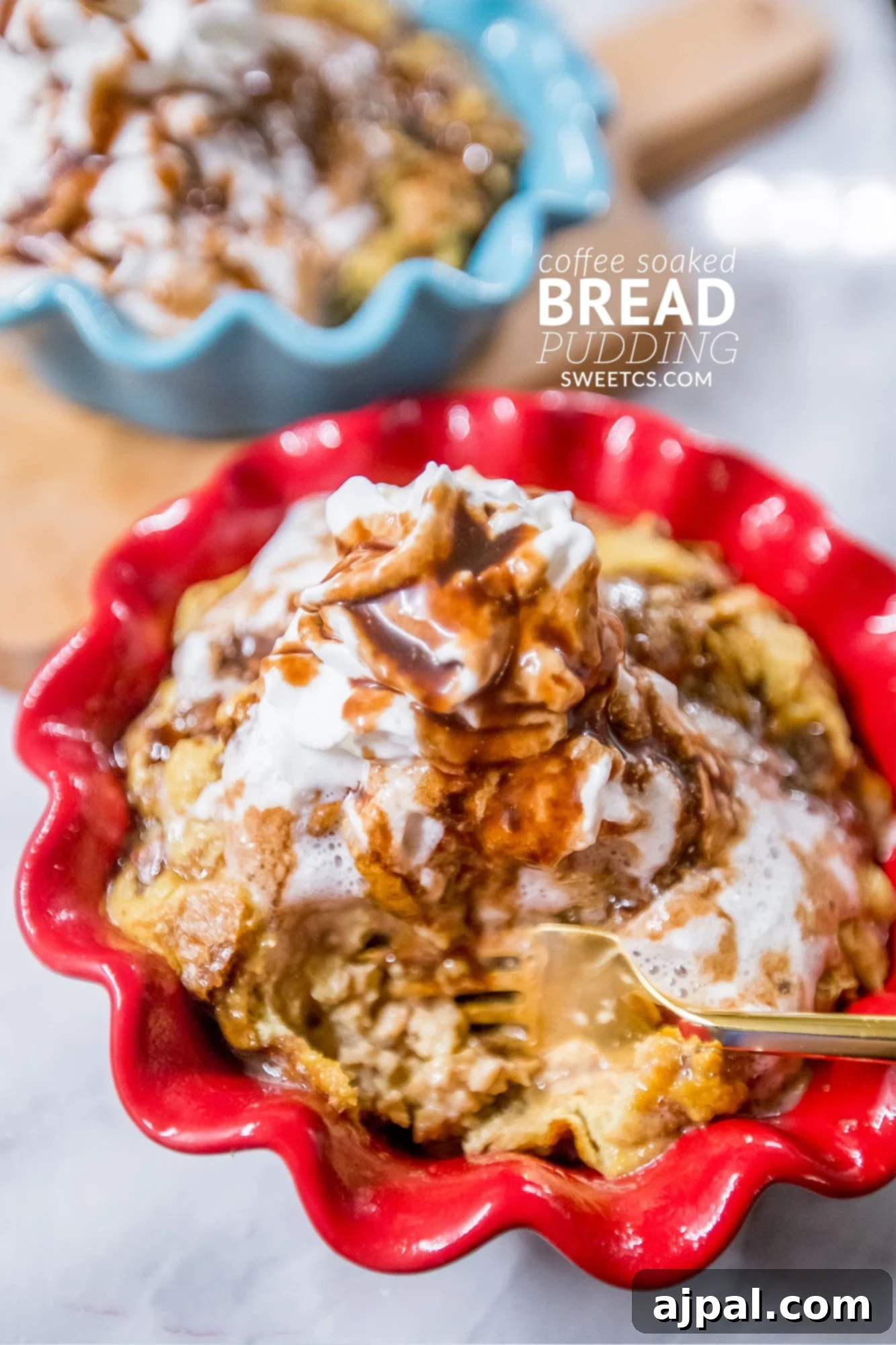 Coffee-Infused Bread Pudding 2 Two bowls of coffee soaked bread pudding topped with fluffy whipped cream and drizzled with luscious caramel sauce, ready to be enjoyed.