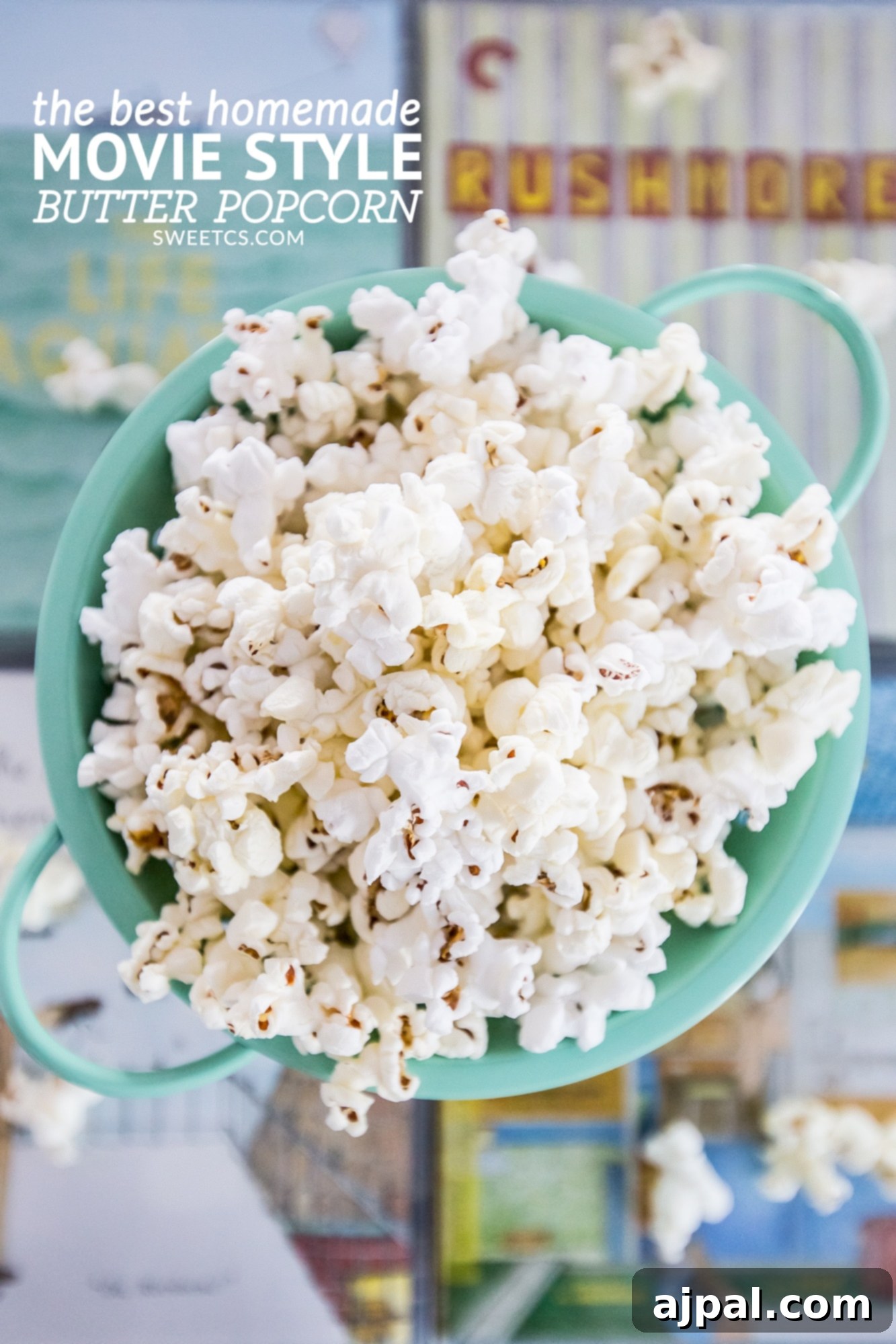 Movie Theater Popcorn Perfection at Home 4 A rustic wooden bowl brimming with fluffy homemade buttered popcorn, alongside a stack of classic books, suggesting a cozy movie night in.
