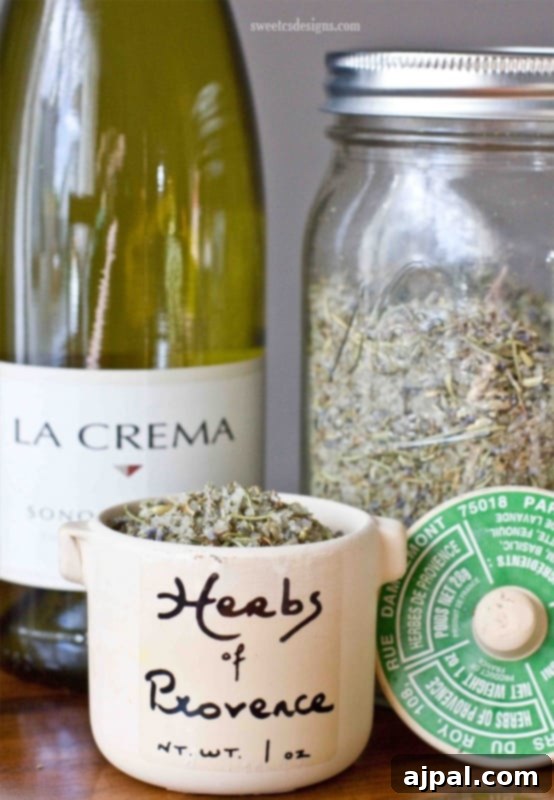 Aromatic Herbs de Provence Pork Chops 4 A charming jar of homemade Herbs de Provence next to a bottle of red wine, showcasing its rustic elegance.