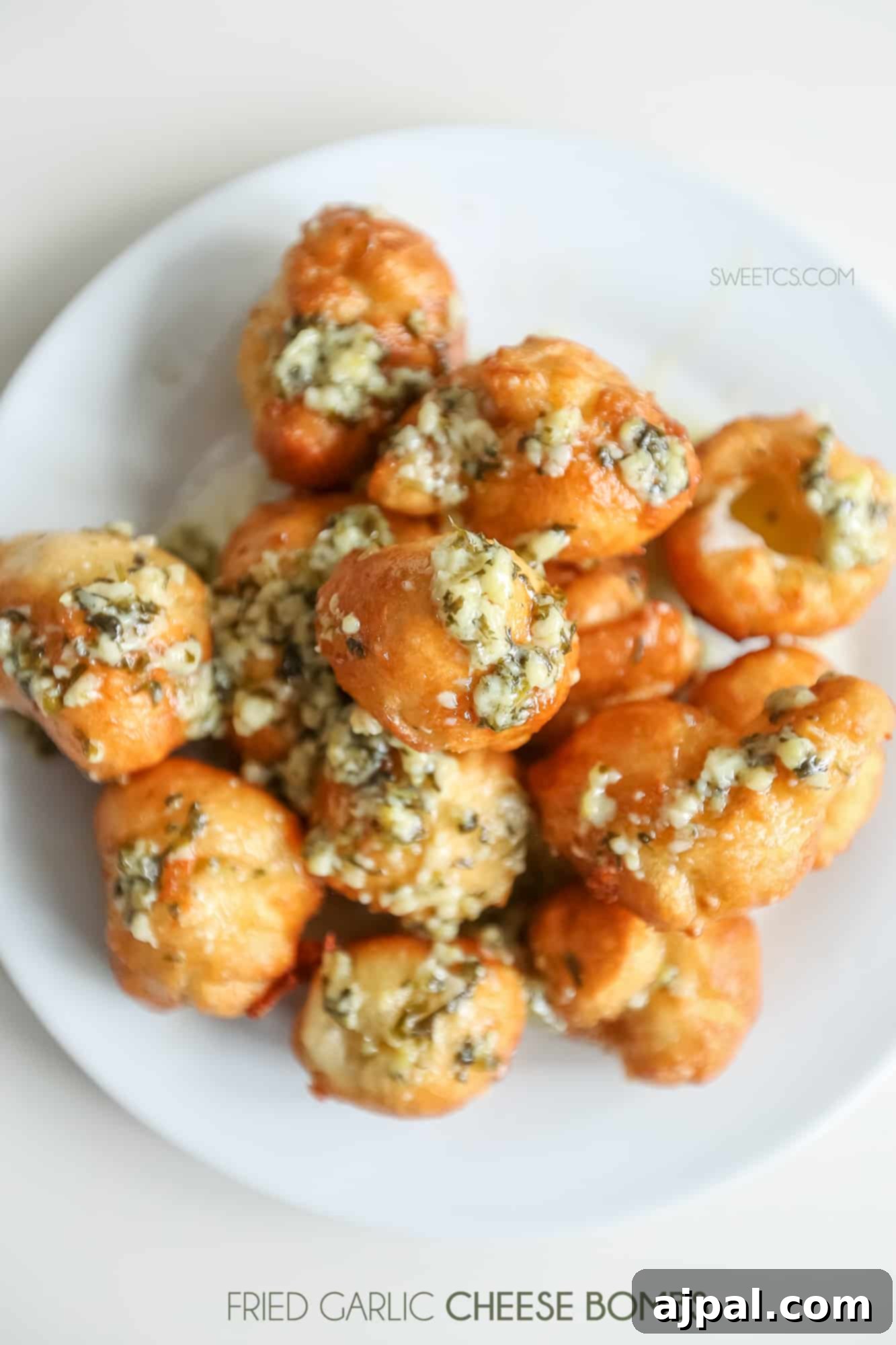 Crispy Garlic Cheese Blasts 5 A vibrant plate of fried garlic cheese bombs, ready for serving.