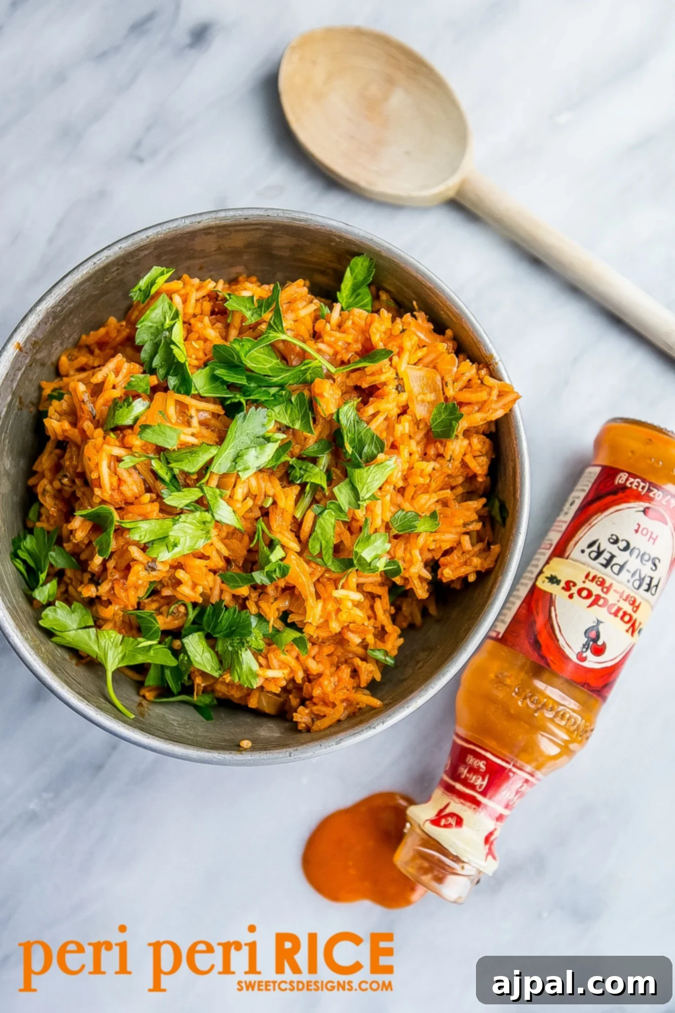 A vibrant bowl of Nando's style spicy peri peri rice, garnished with fresh herbs, ready to be served.
