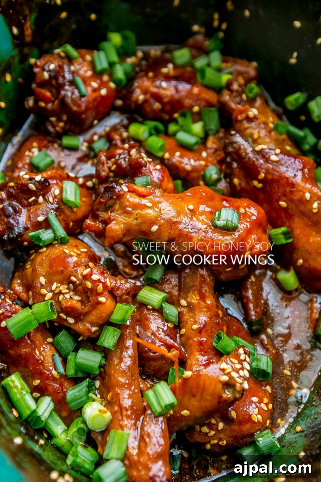 Sticky Honey Soy Slow Cooker Chicken Wings 2 Perfectly glazed honey soy chicken wings in a slow cooker, ready to serve.