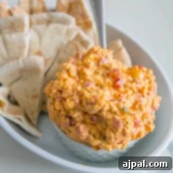 Pimiento cheese dip served with pita chips.