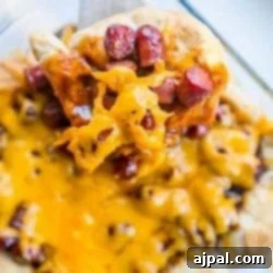 An easy, cheesy casserole with little smokies and BBQ flavors reminiscent of a slice of pizza.