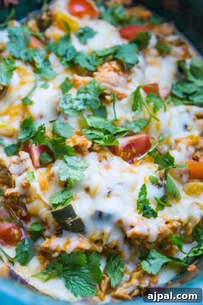 Easy Slow Cooker Chicken Taco Bowls 3 Delicious chicken taco and vegetable mixture, cooked to perfection in a slow cooker and topped with rich, melted cheese