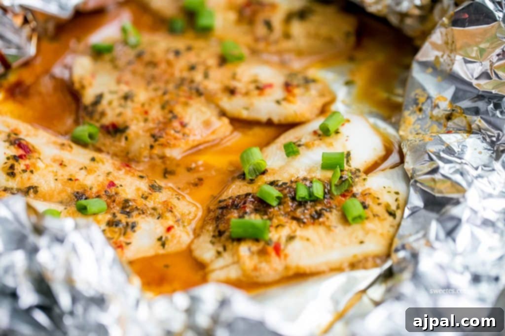 Spicy Garlic Soy Glazed Flounder 3 flounder in a foil pouch with spices and sauce and green onions