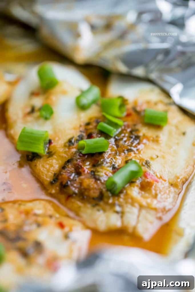 Spicy Garlic Soy Glazed Flounder 4 flounder in a foil pouch with spices and sauce and green onions