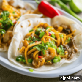 Two Old Bay shrimp tacos on a plate.