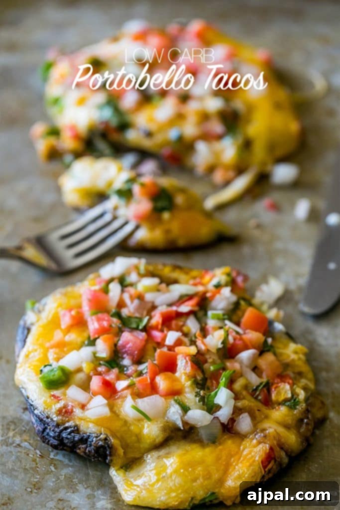 Fiesta Stuffed Mushrooms 4 Three perfectly baked portobello mushrooms, generously stuffed with cheesy taco filling and topped with fresh pico de gallo, highlighting a low-carb, grain-free, and gluten-free meal.