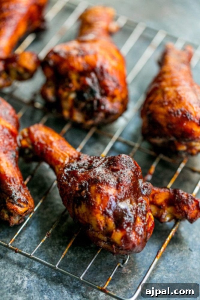 Picture of baked bbq chicken drumsticks on wire rack