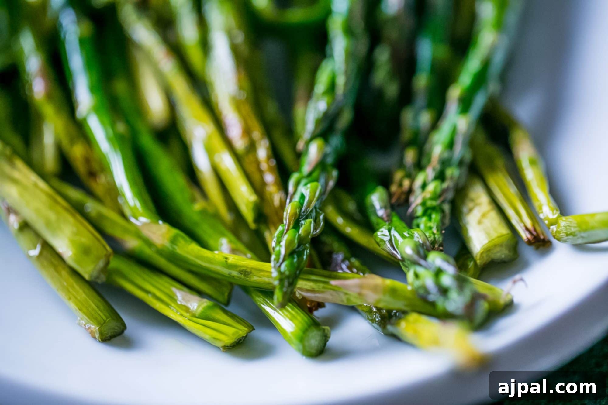 Perfectly Pan-Fried Asparagus 3 Close-up of golden-brown pan-fried asparagus, perfectly cooked and seasoned.