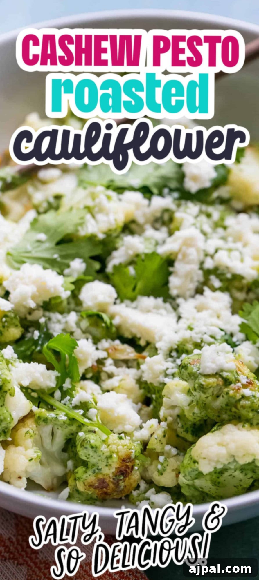 Golden Roasted Cauliflower with Zesty Cashew Pesto 4 cashew pesto covered cauliflower in a white bowl
