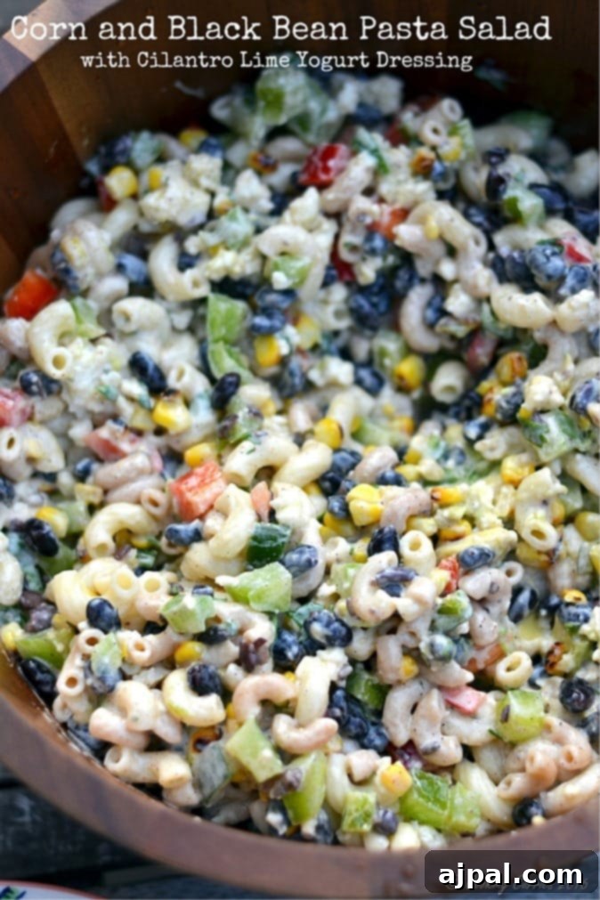Black Bean & Pasta Salad with Cilantro-Lime Vinaigrette 5 A vibrant and refreshing cilantro lime black bean pasta salad, featuring a perfect blend of tender noodles, colorful bell peppers, sweet corn, and protein-rich black beans, all harmoniously mixed and ready to enjoy.